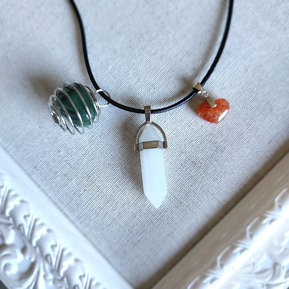 3 crystal pendants on necklace
